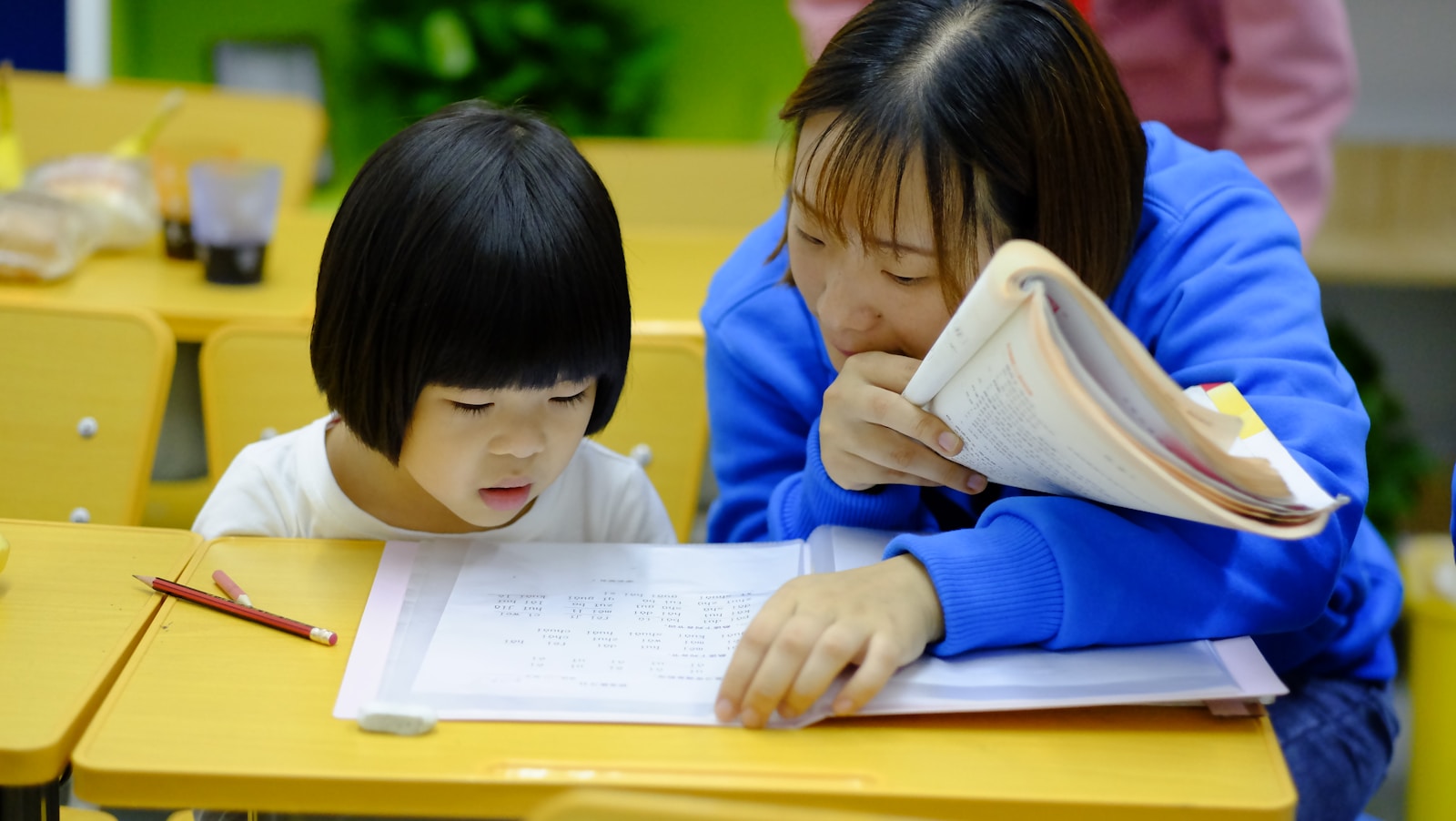Two children practising spoken English together with confidence